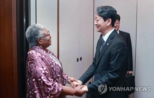 South Korea's Trade Minister Ahn Duk-geun (R) shakes hands with Ngozi Okonjo-Iweala, director general of the World Trade Organization, in Seoul on May 23, 2023, in this photo provided by the Ministry of Trade, Industry and Energy. (PHOTO NOT FOR SALE) (Yonhap)
