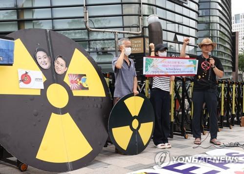 Members of civic groups stage a rally in front of the Japanese Embassy in Seoul on Aug. 22, 2023, to protest the Japanese government's decision to start releasing radioactive water from the crippled nuclear reactors in Fukushima into the ocean on Aug. 24, 2023. (Yonhap)