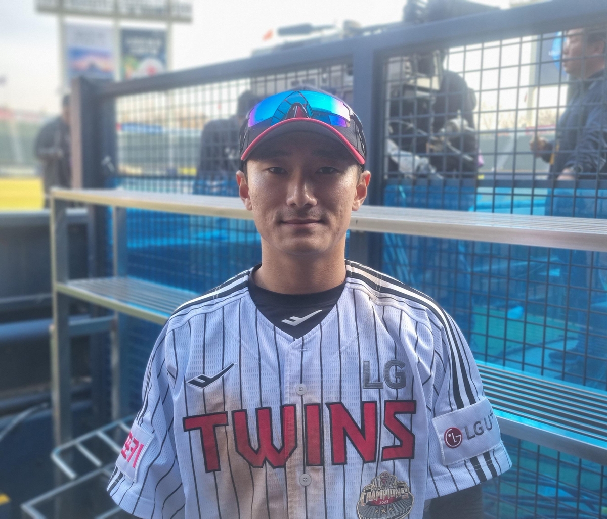 LG Twins infielder Shin Min-jae poses for photos after beating the Hanwha Eagles 8-2 on Opening Day for the Korea Baseball Organization at Jamsil Baseball Stadium in Seoul on March 23, 2024. (Yonhap)