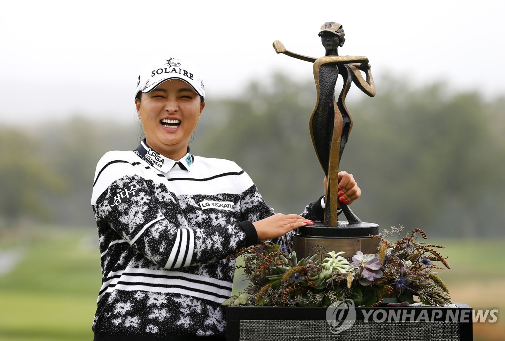 In this Associated Press photo, Ko Jin-young of South Korea poses next to the champion's trophy after winning the Cognizant Founders Cup at Mountain Ridge Country Club in West Caldwell, New Jersey, on Oct. 10, 2021. (Yonhap)
