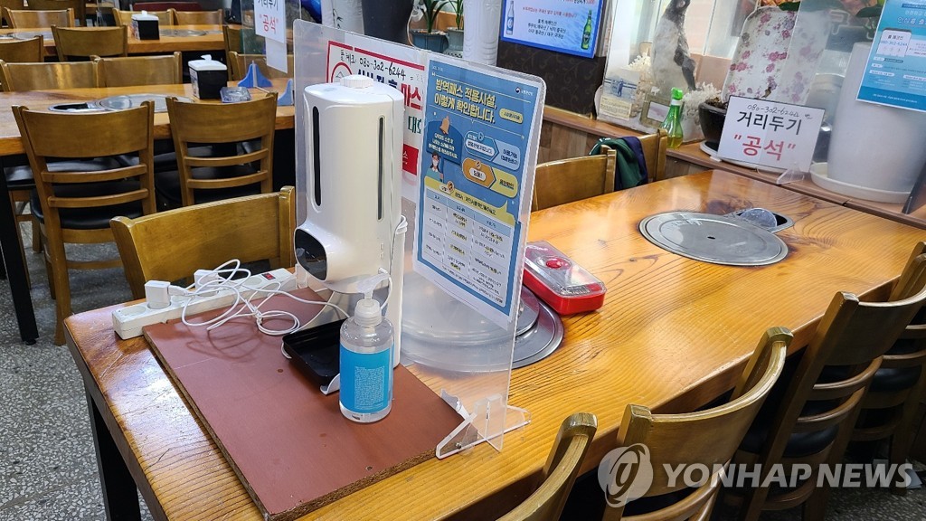 This undated file photo shows a QR code equipment put aside at a restaurant in Seoul as the government suspends the enforcement of the vaccine pass system from Tuesday. (Yonhap)
