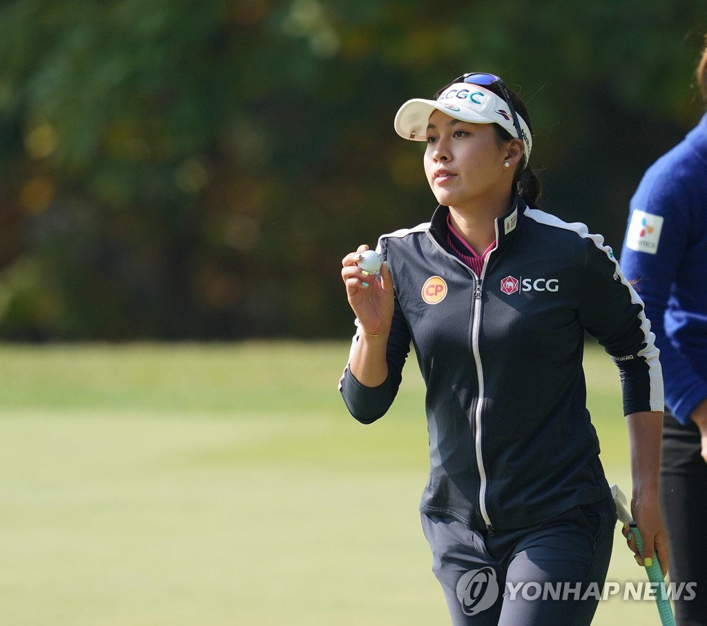 Atthaya Thitikul of Thailand responds to the crowd after recording a par on the first hole during the third round of the BMW Ladies Championship on the LPGA Tour at Oak Valley Country Club in Wonju, Gangwon Province, on Oct. 22, 2022, in this photo provided by BMW Korea. (PHOTO NOT FOR SALE) (Yonhap)