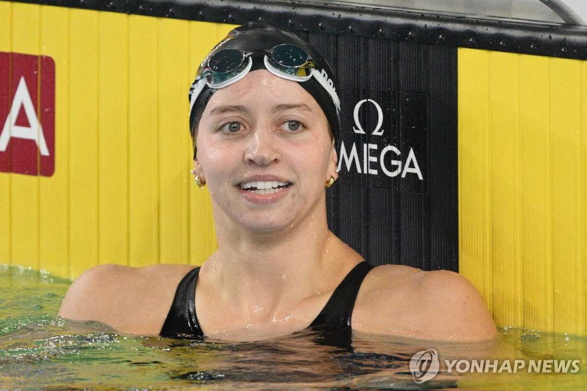 Kate Douglas rejoices after confirming a new world record