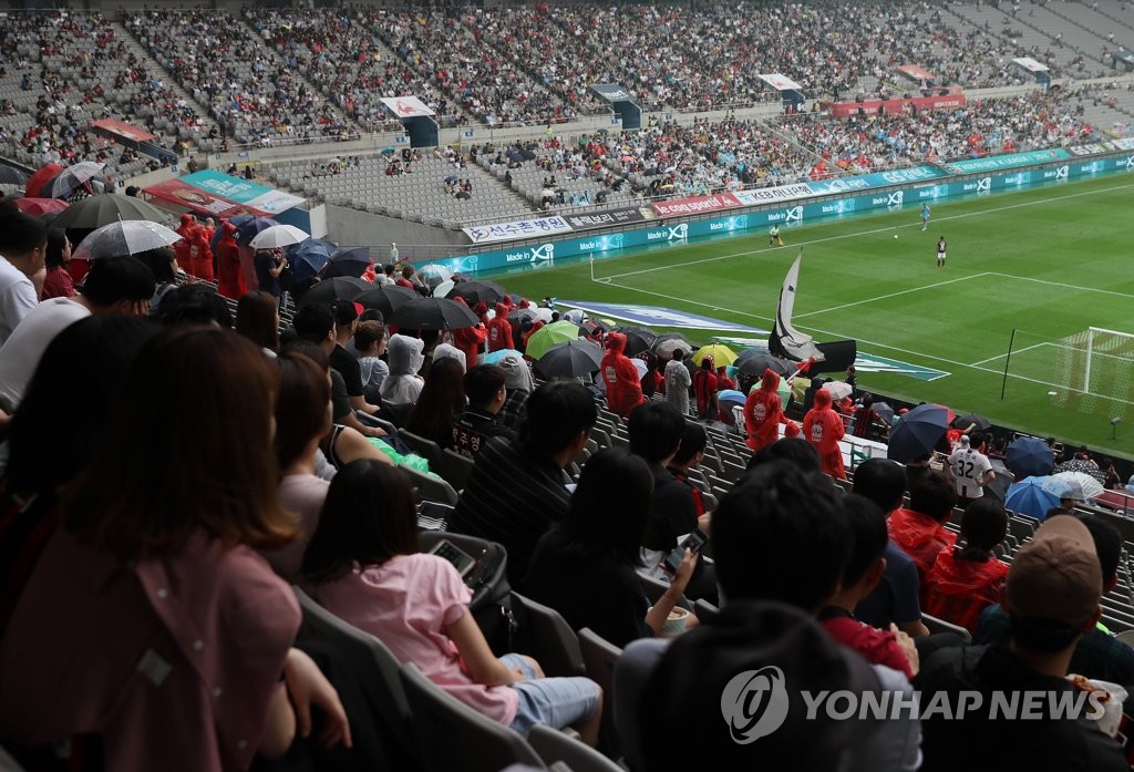 In this file photo taken on Sept. 16, 2018, fans watch a K League 1 match between FC Seoul and Daegu FC at Seoul World Cup Stadium in Seoul. (Yonhap)