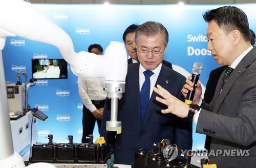  Moon calls for efforts to develop robot industry