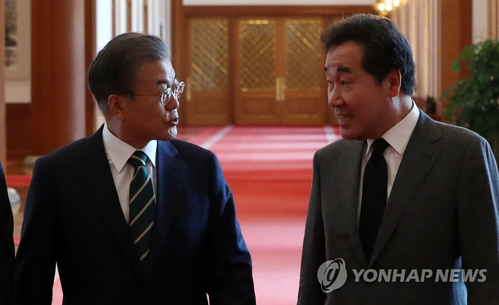文大統領（左）と李代表（資料写真）＝（聯合ニュース）