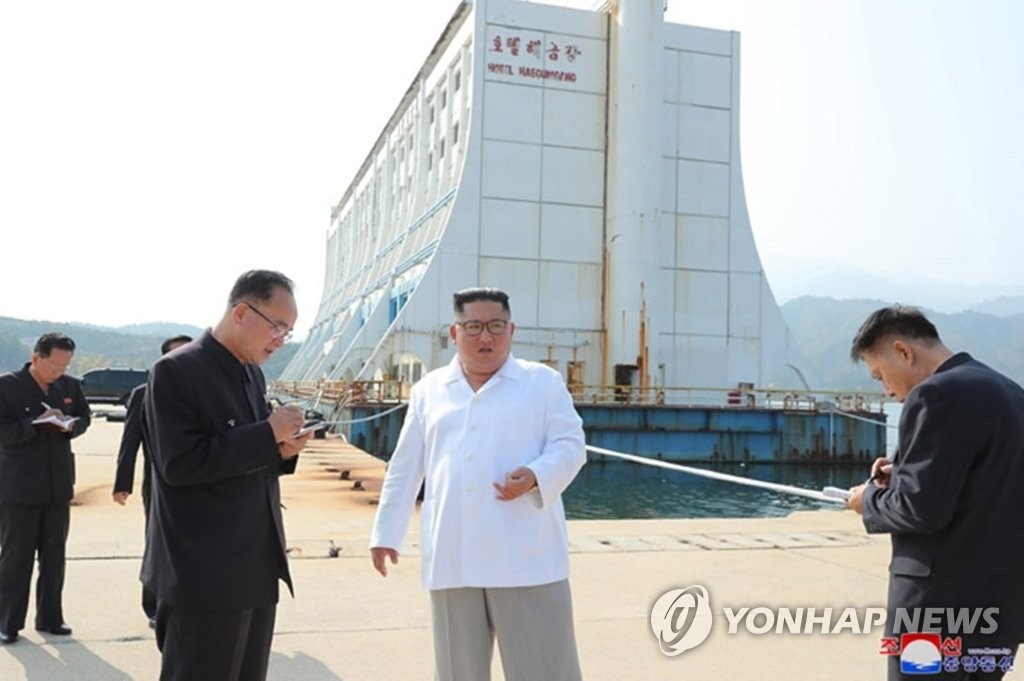 North Korean leader Kim Jong-un (C) inspects the Mount Kumgang resort on the east coast in this photo provided by the Korean Central News Agency (KCNA) on Oct. 23, 2019. Kim ordered the removal of all South Korea-built facilities at the once jointly run tourist spot, according to KCNA. (For Use Only in the Republic of Korea. No Redistribution) (Yonhap)