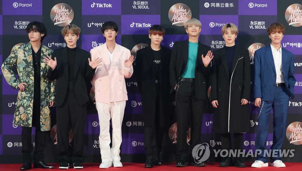 BTS members pose for photos at the 34th Golden Disc Awards ceremony at Seoul's Gocheok Sky Dome on Jan. 5, 2020. (Yonhap)