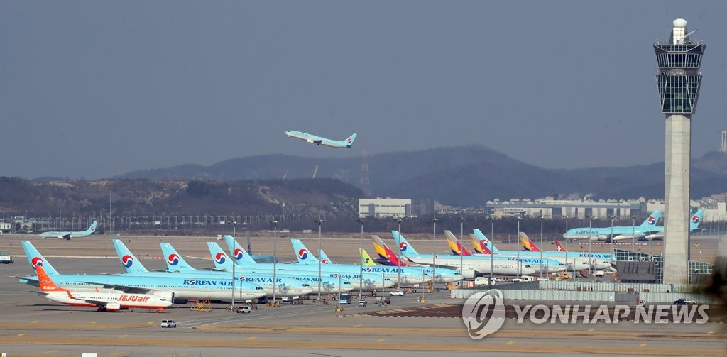 This photo taken on March 2, 2020, shows airplanes parked at Incheon International Airport as the spreading coronavirus outbreak affects air travel demand. (Yonhap)