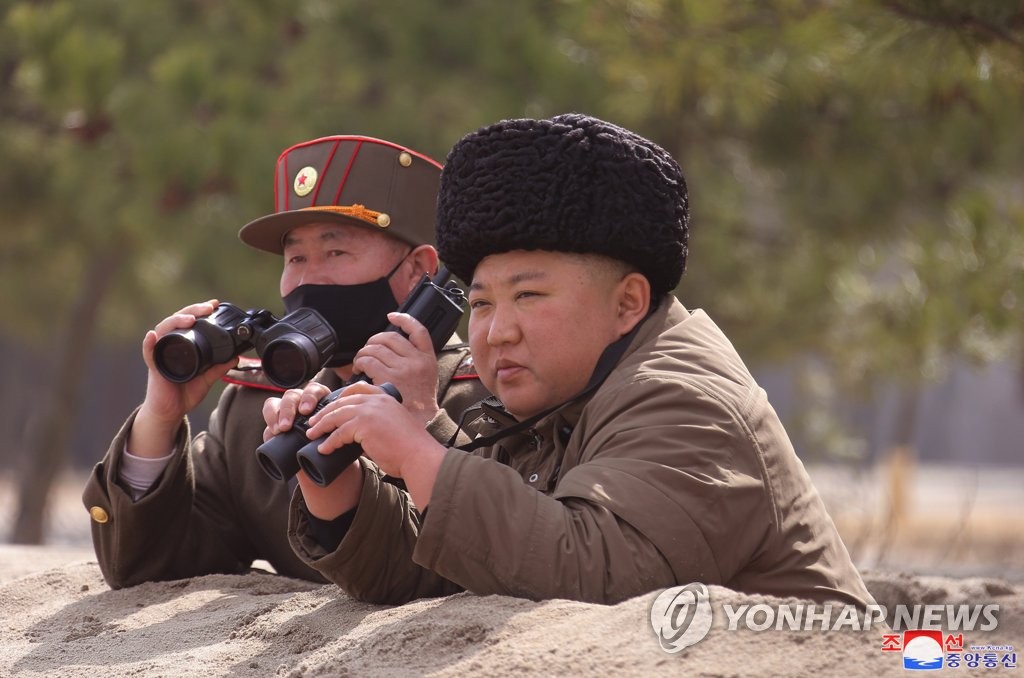 This photo disclosed by the Korean Central News Agency on March 10, 2020, shows Kim Jong-un watching a long-range artillery strike drill. (For Use Only in the Republic of Korea. No Redistribution) (Yonhap)