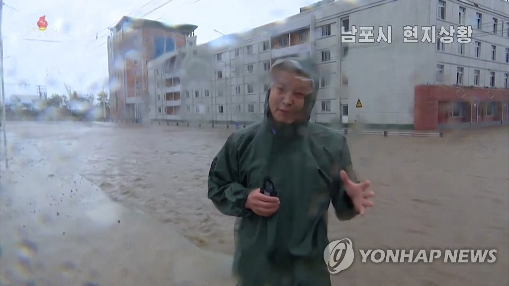 This image, captured from North Korea's Korean Central Television Broadcasting Station, shows a reporter from flooding streets in Nampo, South Pyongan Province, on Aug. 27, 2020. (For Use Only in the Republic of Korea. No Redistribution) (Yonhap)