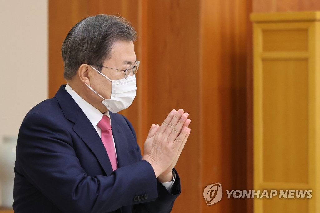 President Moon Jae-in puts his hands together during a Cheong Wa Dae ceremony in Seoul to give newly appointed ambassadors letters of appointment on Dec. 2, 2020. (Yonhap) 