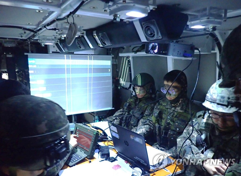 In this undated photo, provided by the arms procurement agency on Jan. 25, 2021, troops are seen inside a command post vehicle. The agency said the vehicle's development, which began in 2017, was completed earlier in the month. (PHOTO NOT FOR SALE) (Yonhap)