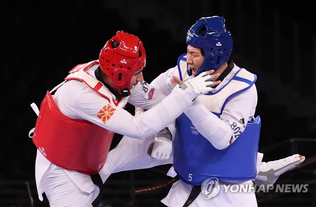 (الأولمبياد) لاعب التايكوندو الكوري «إن كيو-دون» يفوز بالميدالية البرونزية - 1