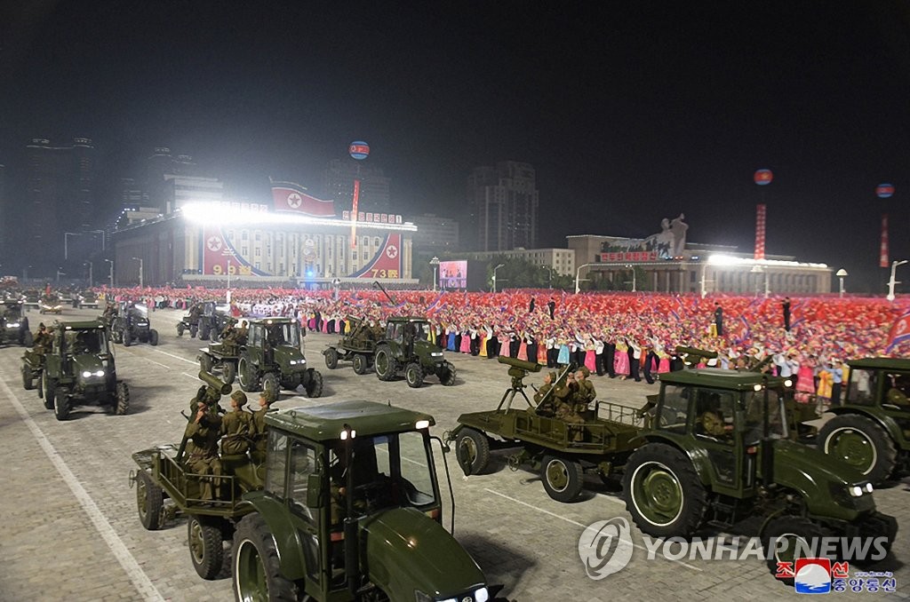 북한, 정권수립 73주년 경축 민간·안전무력 열병식…트랙터 부대