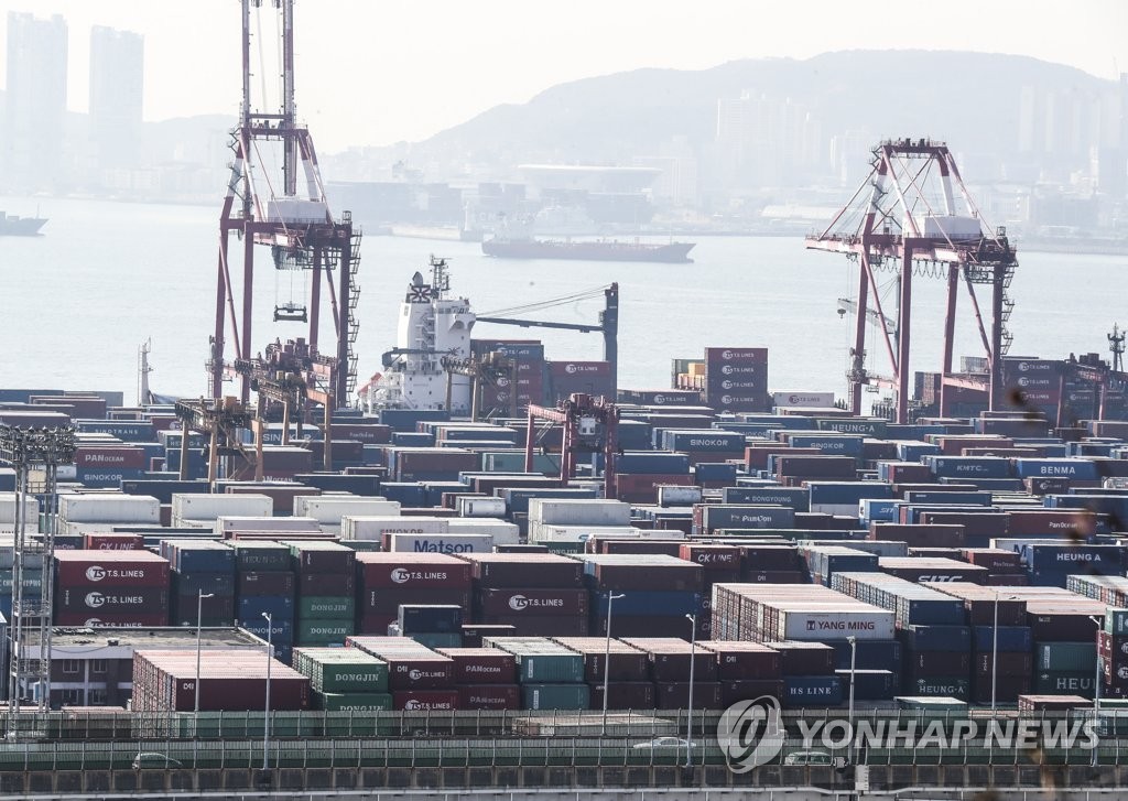 This file photo, taken Feb. 11, 2022, shows stacks of containers at a port in South Korea's southeastern city of Busan. (Yonhap)