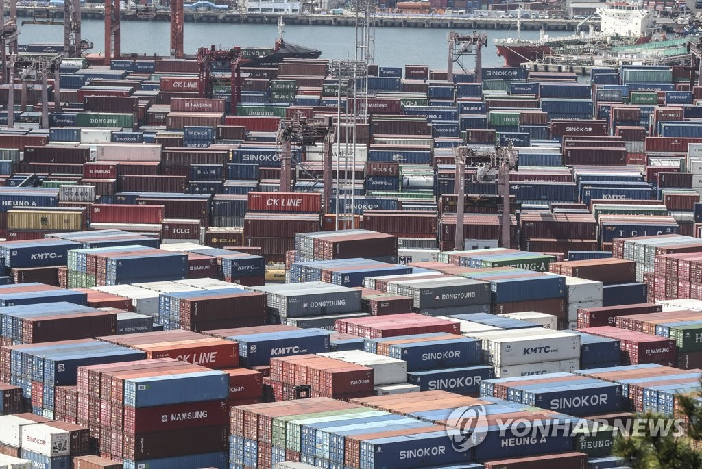 This file photo, taken March 15, 2022, shows stacks of containers at a port in South Korea's southeastern city of Busan. (Yonhap)