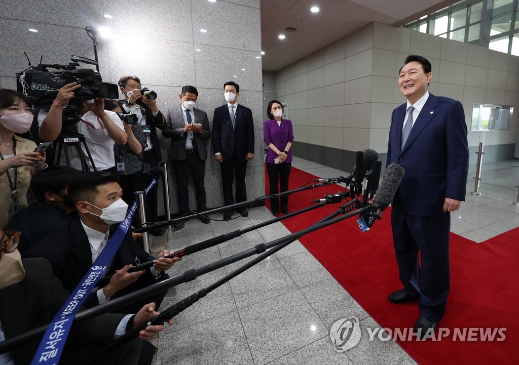 President Yoon Suk-yeol takes reporters' questions as he arrives at his office in Seoul on June 24, 2022. (Yonhap)