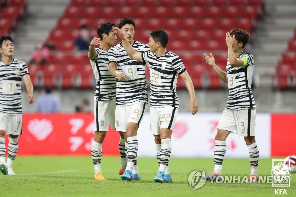 Kwon Chang-hoon of South Korea (2nd from R) celebrates with teammates after scoring a goal against China during the teams' first match at the East Asian Football Federation E-1 Football Championship at Toyota Stadium in Toyota, Japan, on July 20, 2022, in this photo provided by the Korea Football Association. (PHOTO NOT FOR SALE) (Yonhap)