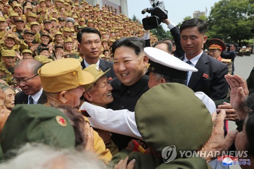 N.K. leader meets with Korean War veterans