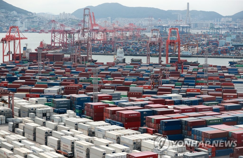 Containers of exports and imports are stacked at a pier in South Korea's largest port city of Busan on Sept. 13, 2022. 