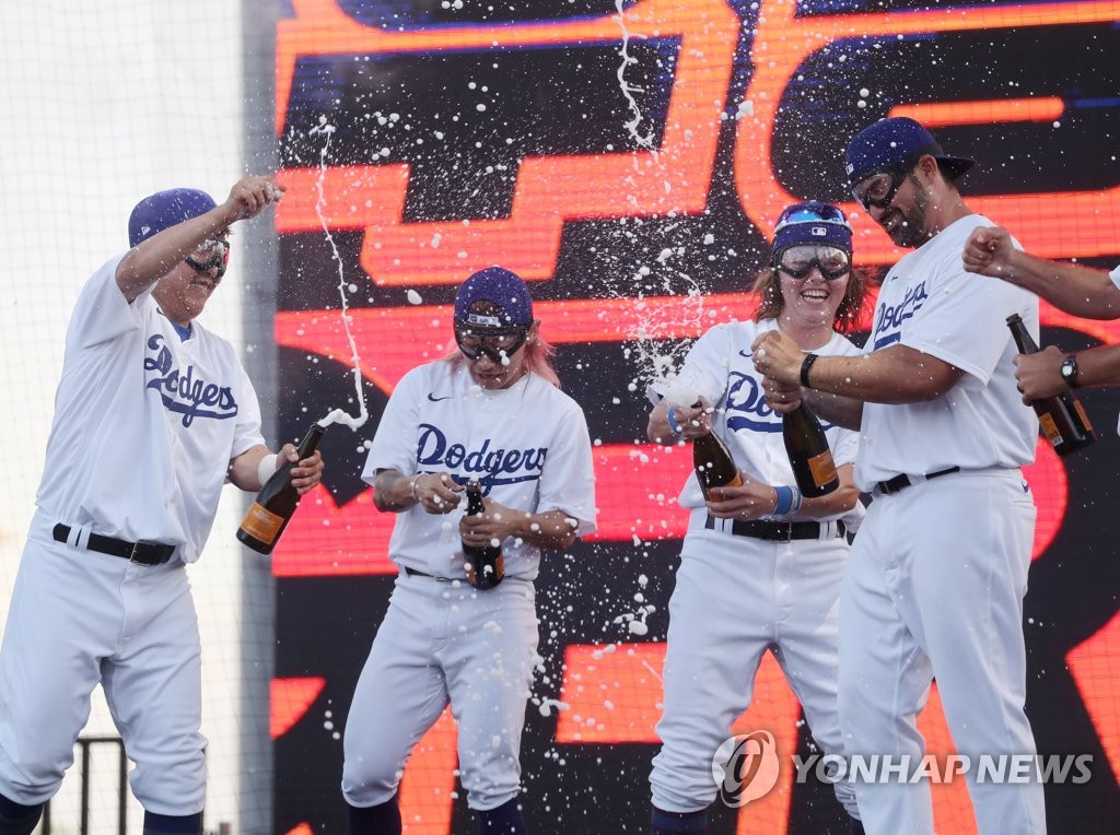 Members of the Los Angeles Dodgers at the FTX MLB Home Run Derby X celebrate their victory with champagne at Paradise City in Incheon, 30 kilometers west of Seoul, on Sept. 17, 2022. (Yonhap)