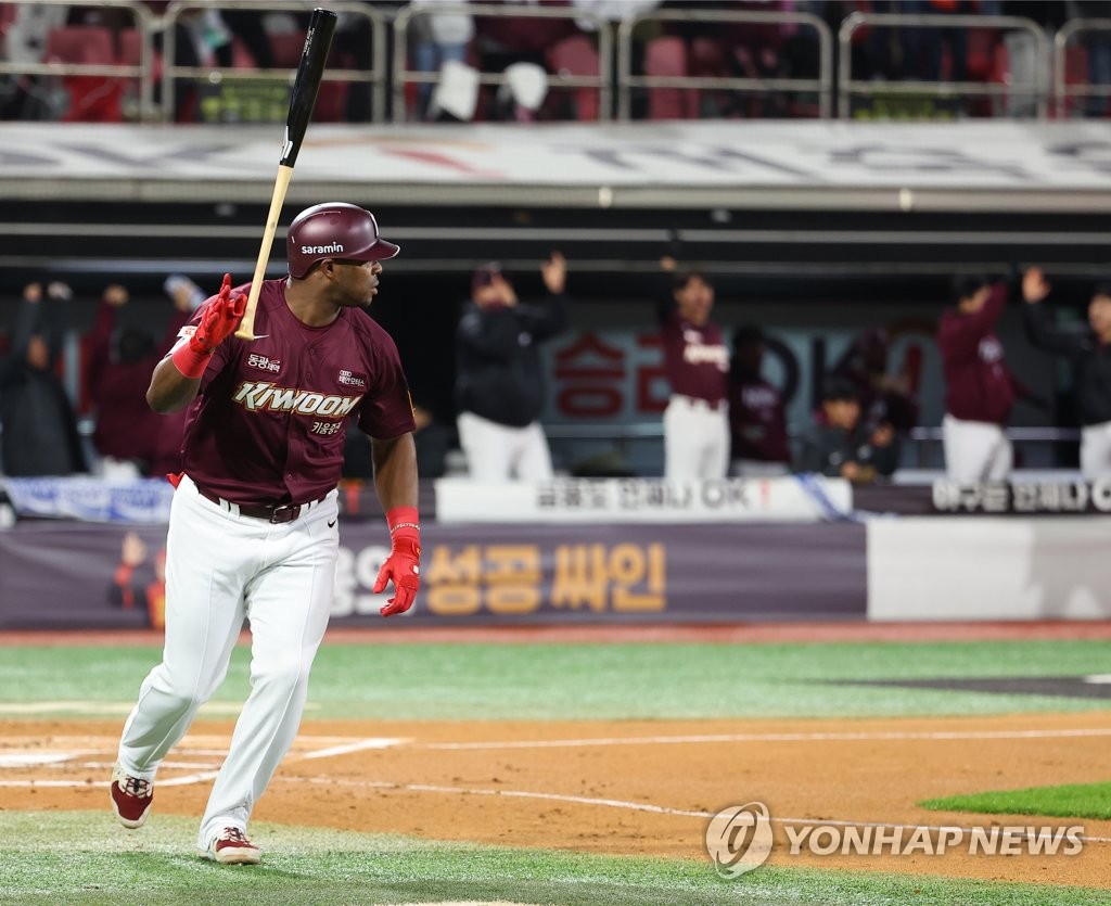 Yasiel Puig of the Kiwoom Heroes flips his bat after hitting a three-run home run against the KT Wiz during the top of the first inning of Game 3 of the first round in the Korea Baseball Organization postseason at KT Wiz Park in Suwon, 35 kilometers south of Seoul, on Oct. 19, 2022. (Yonhap)