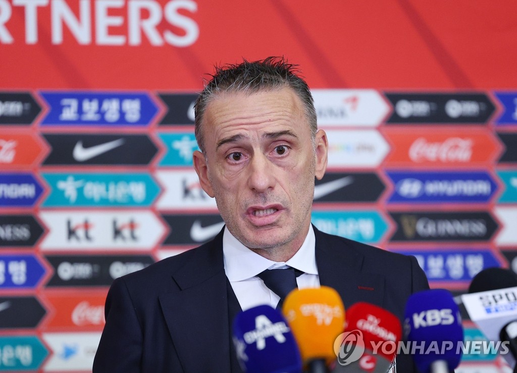 Paulo Bento, head coach of the South Korean men's national football team, speaks to reporters at Incheon International Airport in Incheon, just west of Seoul on Nov. 13, 2022, before traveling to Qatar for the 2022 FIFA World Cup. (Yonhap)