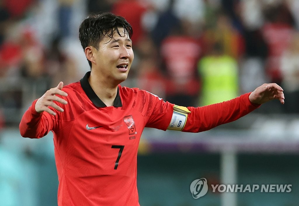 Son Heung-min of South Korea celebrates his team's advance to the round of 16 at the FIFA World Cup following a 2-1 victory over Portugal in a Group H match at Education City Stadium in Al Rayyan, west of Doha, on Dec. 2, 2022. (Yonhap)