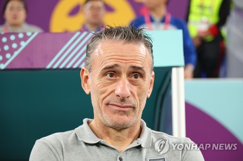 South Korea's head coach Paulo Bento waits for the start of his team's round of 16 match against Brazil at the FIFA World Cup at Stadium 974 in Doha on Dec. 5, 2022. (Yonhap)