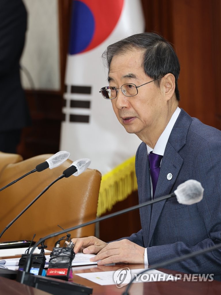 PM defends forced labor solution to mend ties with Japan