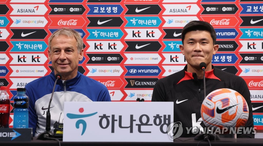 South Korea head coach Jurgen Klinsmann (L) and his defender Kim Min-jae attend a press conference at the National Football Center in Paju, 30 kilometers northwest of Seoul, on March 27, 2023, the eve of a friendly match against Uruguay. (Yonhap)