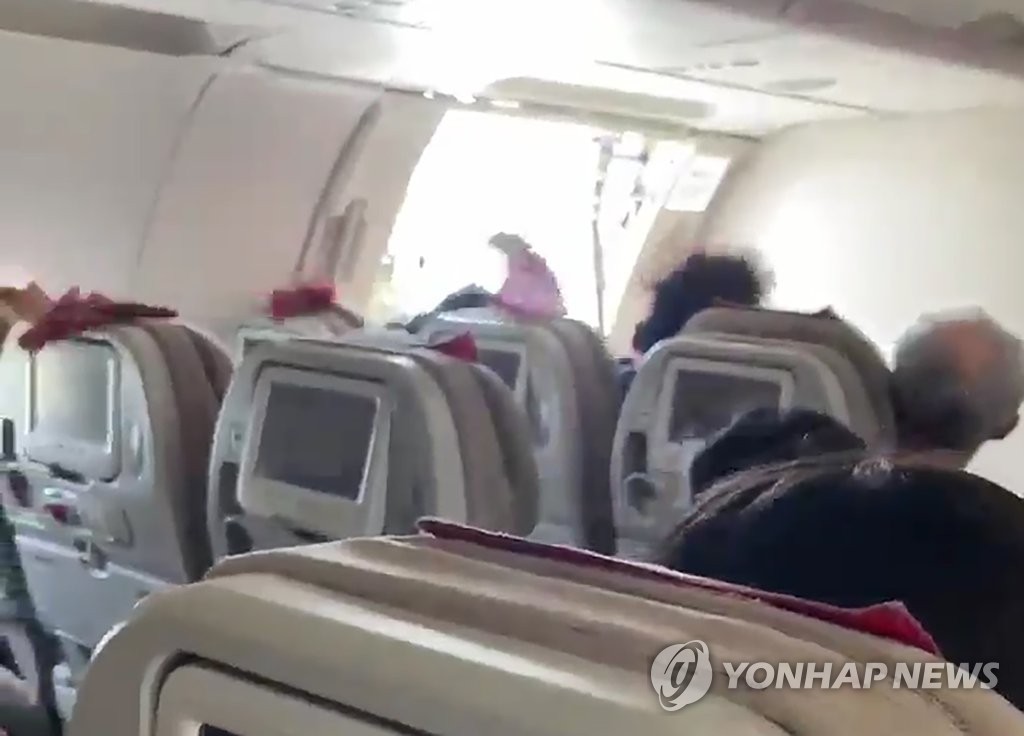 Asiana Airlines plane's door opens right before landing