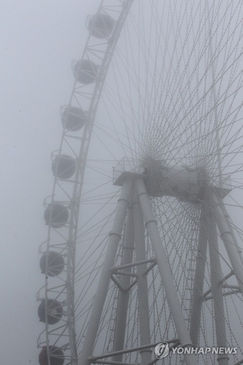 Fog-shrouded amusement park