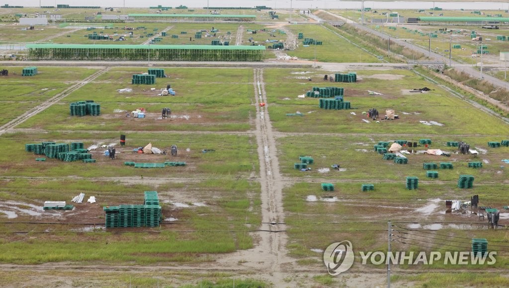 Pools are seen at campsites at Saemangeum, the main venue for the 2023 World Scout Jamboree, on Aug. 11, 2023, after heavy rain pounded the reclaimed land on the southwestern coast. (Yonhap)